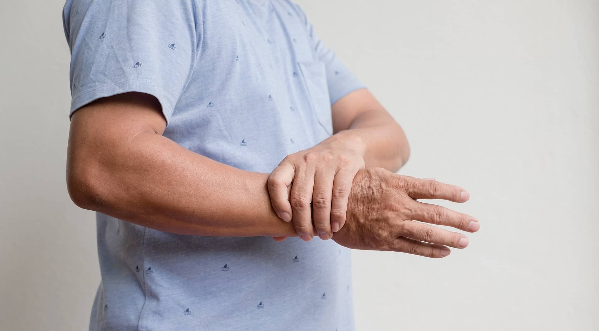 Man hand with numbness and pain in the wrist has pain and tingling in the nerve endings. which